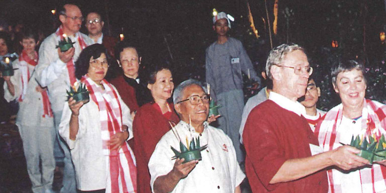 Thai alumni wearing cream and crimson