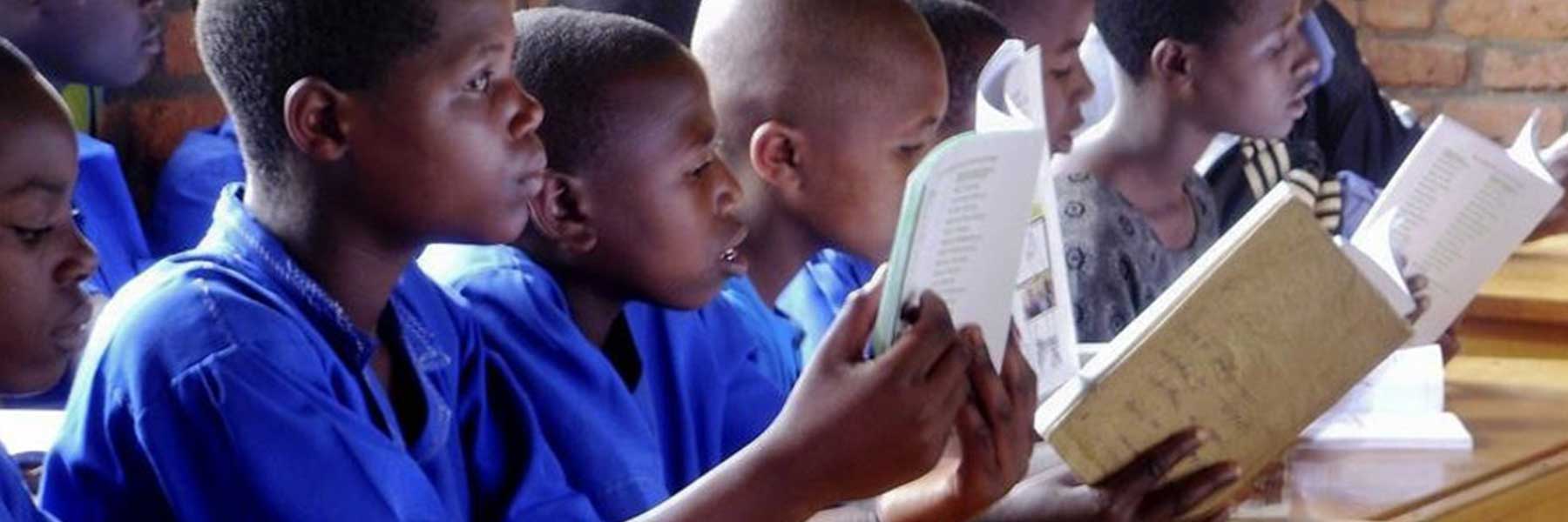 Young students read books.