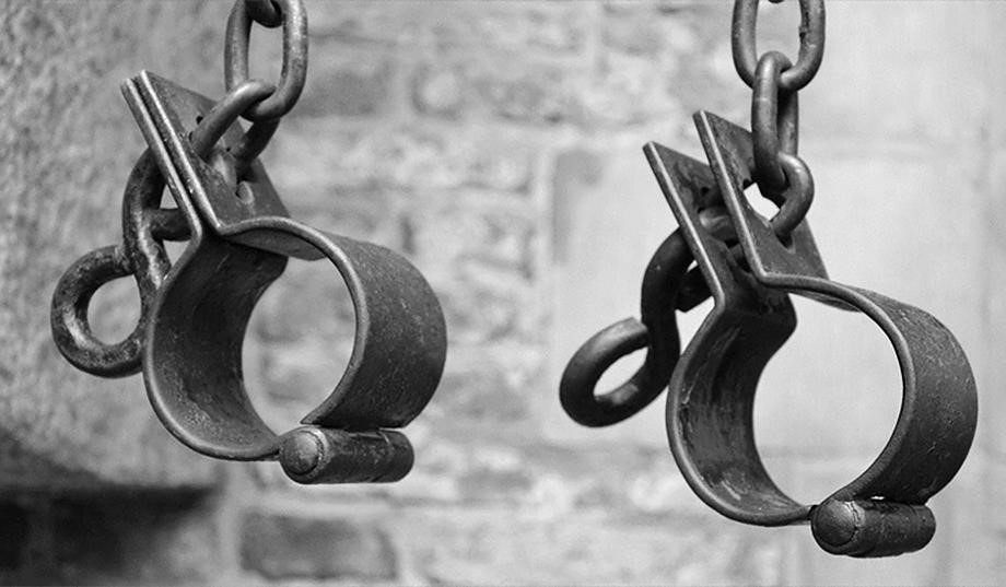 Black and white picture of iron shackles. 